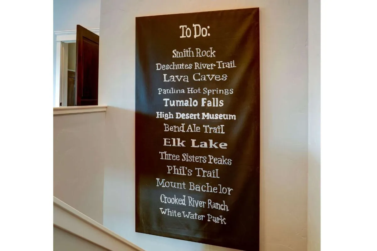 An interior scene featuring a to-do list on the wall, subtly implying guests' plans to explore local attractions and activities. The room is styled for organization and communal planning, making it ideal for groups preparing for outings.